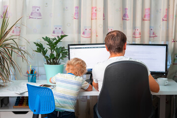 Wall Mural - Father with kid trying to work from home during quarantine. Stay at home, work from home concept during coronavirus