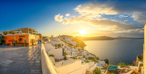 Picturesque sunrise on famous view resort over Oia town on Santorini island, Greece, Europe. famous travel landscape. Summer holidays. Travel concept background.