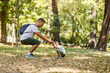 © Dusan Petkovic - Father and son doing squats in nature and living healthy life.