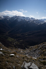 snow mountains over a green valley in picos de europa,national park, spain