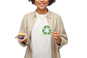 Wall Mural - eco living, environment and sustainability concept - portrait of happy smiling woman holding green recycling sign and alkaline batteries over white background