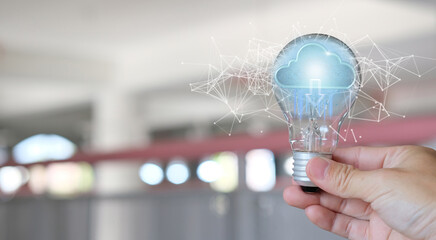 Poster - Hand in hand the lightbulb Connection to the Internet from anywhere in the world. Financial and banking, digital link technology, big data, and business worldwide internet connection 