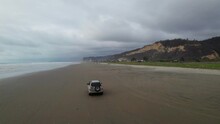 Following A SUV With A Drone On The Beach In Ecuador Filmed In 5k