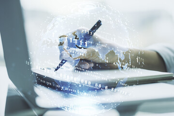 Poster - Multi exposure of abstract software development hologram with world map and hand writing in notebook on background with laptop, global research and analytics concept