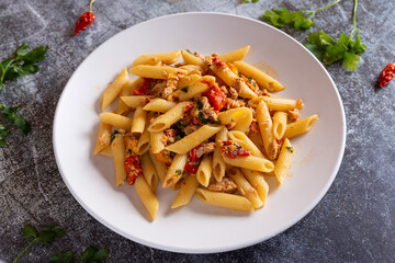 Wall Mural - Penne with tuna and peppers. Easy and quick recipe typical of Mediterranean cuisine