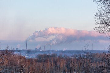 Wall Mural - Smoke from the chimneys of a steel plant at sunset