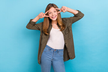 Wall Mural - Photo of funky good mood little woman showing v-sign on eyes hipster culture isolated on blue color background