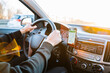 © Maksym - Gps car map system. Global positioning system on smartphone screen in auto car on travel road. Navigation auto location system app.