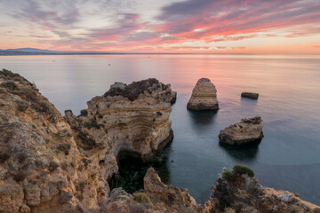 Wall Mural - Coastal cliffs of Algarve, Lagoa, Portugal Summer season in most popular tourist region.