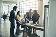 © Lyndon Stratford/peopleimages.com - We can only go up from here. Shot of a diverse team of businesspeople brainstorming their latest project together in the office.