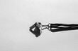 Sports whistle on grey background. Concept - sport competition, referee, statistics, challenge. Basketball, handball, futsal, volleyball, soccer, baseball, football and hockey referee whistle