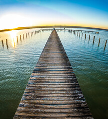 Wall Mural - old wooden jetty at a lake