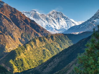 Wall Mural - light and shadow on the hill edges with view to mounts lhotse and everest under blue sky in nepal