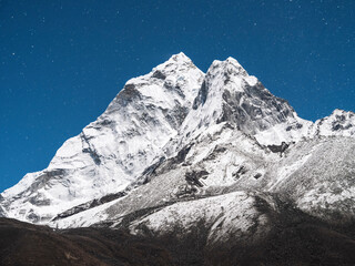 Wall Mural - Falling stars above mount Ama-Dablam in night shot in Nepal