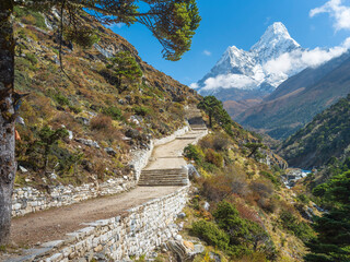 Wall Mural - old stone road with steps and view to mount ama-dablam in nepal