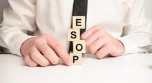 Word ESOP On Wooden Blocks, White Background, Business Concept. Business And Finance