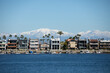 Long Beach California in winter, view over the bay at houses with boats and mountains with snow, Belmont Shore