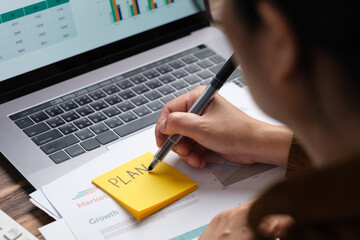 Poster - asian woman holding paperwork flow of project checking with laptop data working at home
