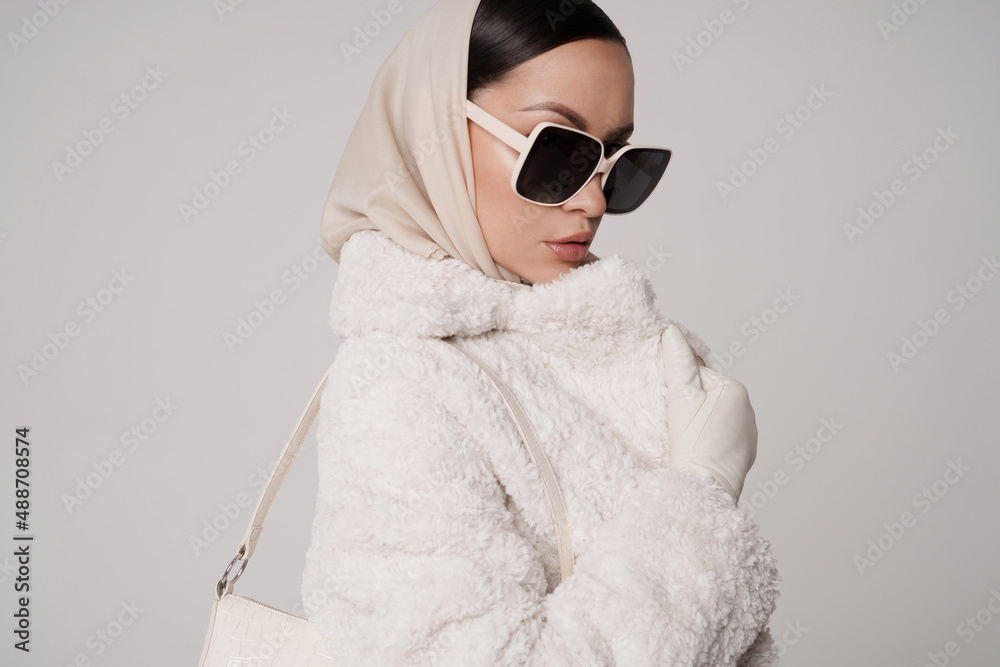 Beautiful young lady in a white faux fur coat Stock Photo | Adobe Stock