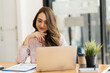 © PaeGAG - Business, finance and employment, female successful entrepreneurs concept. Confident smiling asian businesswoman, office worker in suit using laptop, help clients.