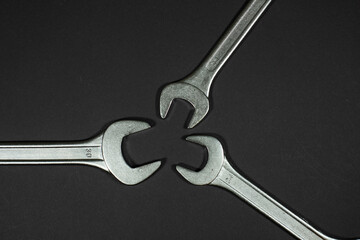 wrenches on a black background