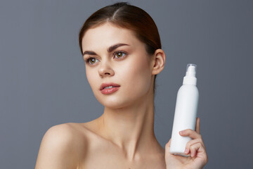 Wall Mural - young woman body lotion rejuvenation cosmetics close-up Lifestyle