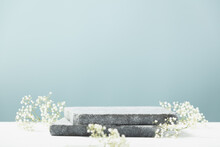 Flat Granite Pedestal And White Flowers On Blue Background.  Showcase For Cosmetic Products. Product Advertisement. Layout Style Design.