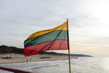 Lithuanian Flag In Wind At Coast Of Lithuania.