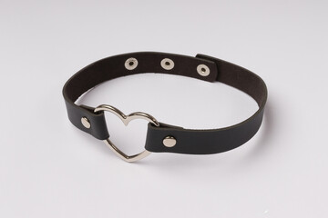 black collar with a metal heart for a woman on a white background