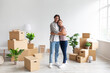 © Prostock-studio - Glad young caucasian male and female in casual hugging in room with cardboard boxes, renting flat and relocation