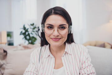 Poster - Portrait of attractive cheerful skilled experienced woman answering customer call insurance staying at home indoors