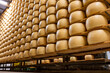 Process of making parmigiano-reggiano parmesan cheese on small cheese farm in Parma, Italy, factory maturation room for aging of cheese wheels up to 5 years