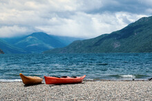 Kayaks On The Lake. Stunning View Of The Coast In Nature. Relaxing Vacations, Travel, Adventure Exploration.
