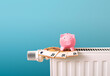 energy and heating costs, piggy bank on radiator and money bank notes