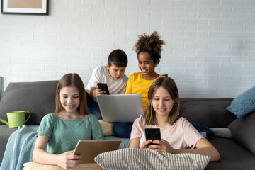 Wall Mural - Multiethnic diverse teens studying at home for online school