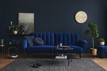 Creative compositon of modern living room interior design with glamour blue sofa, metal shelf, coffee table and elegant home accessories. Dark blue wall. Home staging. Template. Copy space.