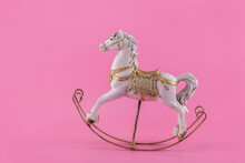 Antique Stylized Toy Horse On A Pink Background