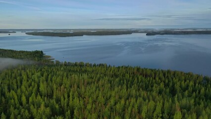 Poster - Aerial view of Pulkkilanharju Ridge, Paijanne National Park, southern part of Lake Paijanne. Landscape with drone. Blue lakes, road and green forests from above on a sunny summer day in Finland.