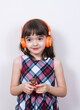 © gmstockstudio - Little girl using the earphones