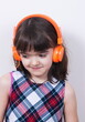 © gmstockstudio - Little girl using the earphones