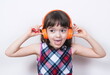 © gmstockstudio - Little girl using the earphones