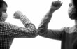 © Yevhen - Closeup elbow bump. Couple greeting with elbows. Elbows bump. Coronavirus, illness, quarantine, medical mask, COVID19. Friends in protective medical mask on his face greet their elbows in quarantine