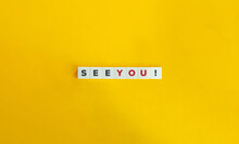 See You Phrase On Letter Tiles On Yellow Background. Minimal Aesthetics.