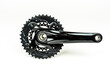 black chainring and crank on white background. bicycle gear