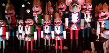 Wooden Nutcracker Statues Standing In A Row As A Christmas Decoration, Night Shot