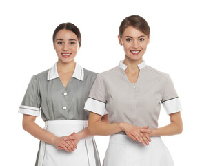 Canvas Print - Portrait of chambermaids in tidy uniforms on white background