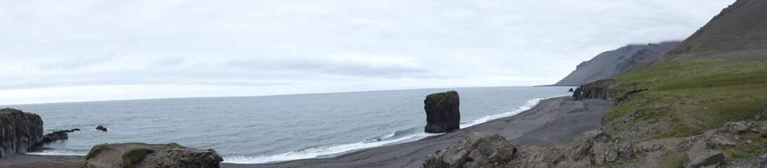 Wall Mural - A panoramic view of Reynisfjara Black Sand Beach in Iceland