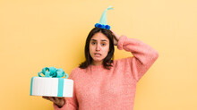 Young Hispanic Woman Feeling Stressed, Anxious Or Scared, With Hands On Head. Birthday Concept