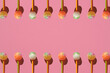 Colorful Set of Lollipops. pattern made with caramel on a stick on bright pink background.  creative pattern.