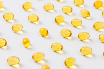 Close up of  oil filled capsules suitable for: fish oil, omega 3, omega 6, omega 9,  vitamin A, vitamin D, vitamin D3, vitamin E - Image